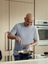 Andre Agassi cooking vegetables in a SILVERCREST frying pan.