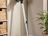 SILVERCREST cordless vacuum cleaner placed in a modern home interior.