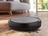 SILVERCREST robot vacuum cleaner in use on a wooden floor.
