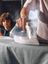Person ironing clothes at home using a SILVERCREST steam iron.