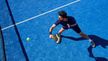 Overhead view of a padel player during a match with CRIVIT sports equipment on the court.