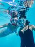 Two women snorkeling underwater with CRIVIT masks and snorkels