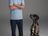 Andre Agassi and his dog sharing a friendly moment during the photo shoot.